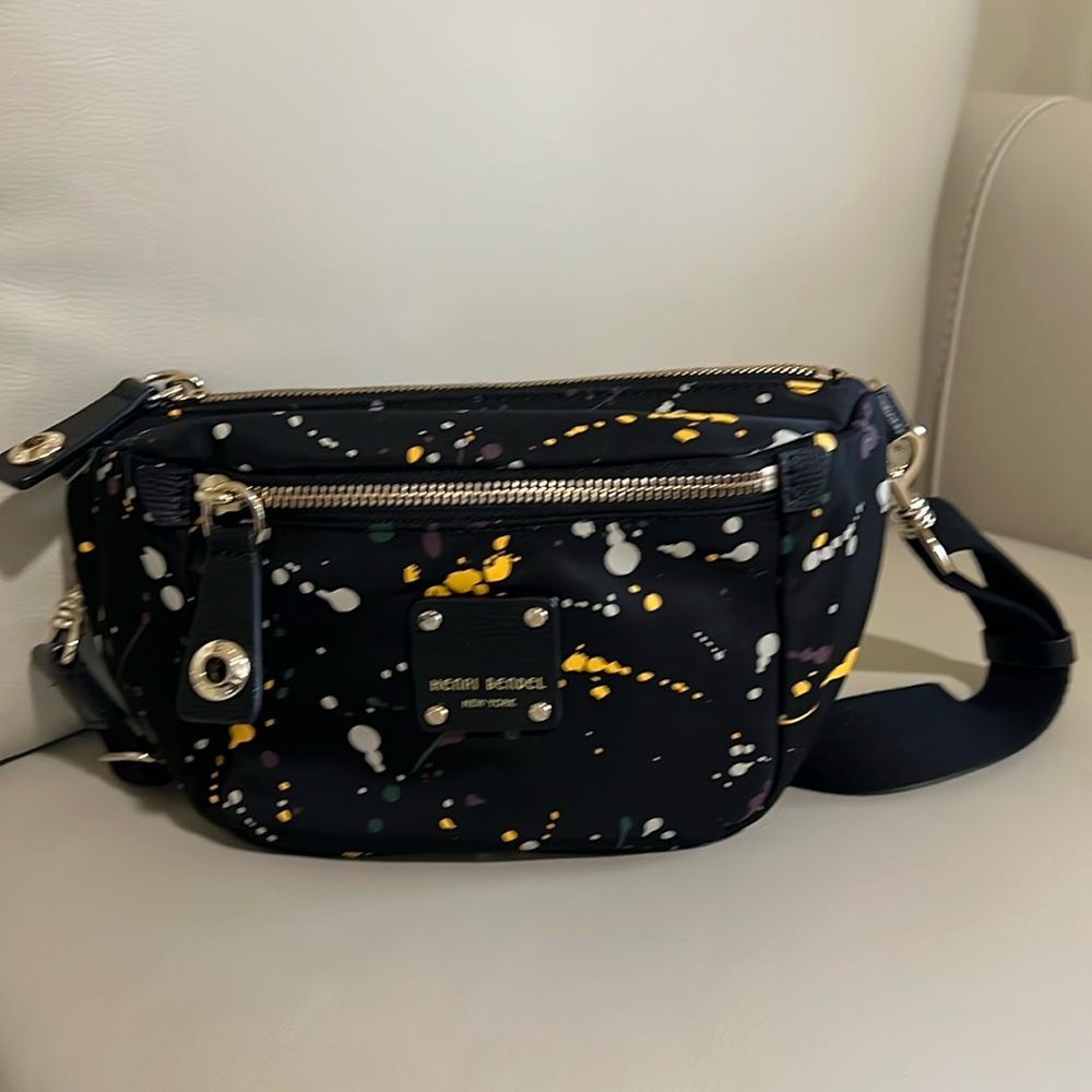 Henri Bendel Fanny pack in polyester with leather trim.